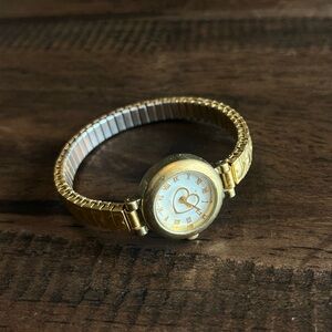Gold Tone Watch with Heart Detailing on Band and Watch Face